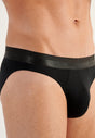 Close-up view of a men model wearing HO black cotton Mini Briefs