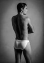 Back view of a men model wearing HO white cotton Tanga Briefs