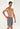 Front view of a men model wearing HO grey  Shorts