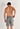 Back view of a men model wearing HO grey  Shorts