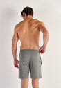 Back view of a men model wearing HO grey  Shorts