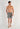 Full-body view of a men model wearing HO grey  Shorts