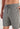 Close-up view of a men model wearing HO grey  Shorts