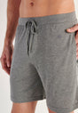 Close-up view of a men model wearing HO grey  Shorts