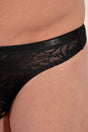 Close-up view of a men model wearing HO black  G-String