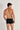 Back view of a men model wearing HO black cotton Boxer Briefs HO1