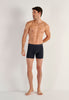 Full-body view of a men model wearing HO navy cotton Long Boxer Briefs HO1