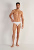 Full-body view of a men model wearing HO white cotton Briefs HO1