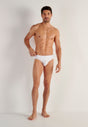 Full-body view of a men model wearing HO white cotton Briefs HO1