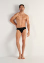 Full-body view of a men model wearing HO black cotton Briefs HO1