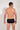 Back view of a men model wearing HO black  Swim Midi Briefs