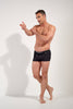 General view of a men model wearing HO black  Swim Shorts