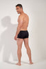 General view of a men model wearing HO black  Swim Shorts