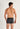 Back view of a men model wearing HO black/grey cotton Boxer Briefs HO1 2p