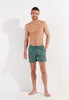 Full-body view of a men model wearing HO khaki green  Beach Boxer