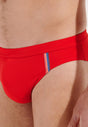 Close-up view of a men model wearing HO red  Swim Mini Briefs