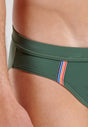 Close-up view of a men model wearing HO khaki green  Swim Mini Briefs