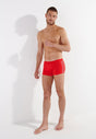 Full-body view of a men model wearing HO red  Swim Shorts