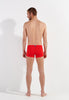 General view of a men model wearing HO red  Swim Shorts