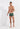 Full-body view of a men model wearing HO khaki green  Swim Shorts