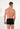 Back view of a men model wearing HO black/black print cotton Boxer Briefs HO1 2p