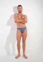 Full-body view of a men model wearing HO midblue  Micro Briefs