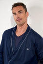 Close-up view of a men model wearing HO navy cotton Robe