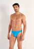 Front view of a men model wearing HO turquoise  Swim Micro Briefs
