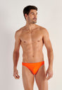 Front view of a men model wearing HO orange  Swim Micro Briefs