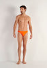 Full-body view of a men model wearing HO orange  Swim Micro Briefs