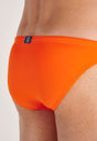 Close-up view of a men model wearing HO orange  Swim Micro Briefs