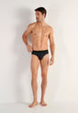 Full-body view of a men model wearing HO black modal/viscose/tencel Briefs HO1