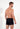 Back view of a men model wearing HO black  Boxer Briefs