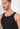 Close-up view of a men model wearing HO black cotton Tanktop