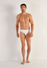 Full-body view of a men model wearing HO white modal/viscose/tencel Comfort Briefs HO1