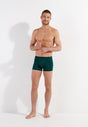 Full-body view of a men model wearing HO dark green modal/viscose/tencel Comfort Boxer Briefs HO1