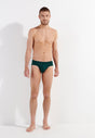 Full-body view of a men model wearing HO dark green modal/viscose/tencel Comfort Briefs
