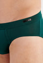 Close-up view of a men model wearing HO dark green modal/viscose/tencel Comfort Briefs