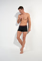 General view of a men model wearing HO black/black/black cotton Boxer Briefs HO1 3p