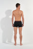 General view of a men model wearing HO black/black/black cotton Boxer Briefs HO1 3p
