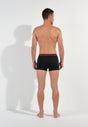 General view of a men model wearing HO black/black/black cotton Boxer Briefs HO1 3p