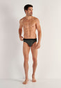 Full-body view of a men model wearing HO black/black print cotton Mini Briefs HO1 2p