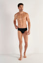 General view of a men model wearing HO black/black print cotton Mini Briefs HO1 2p